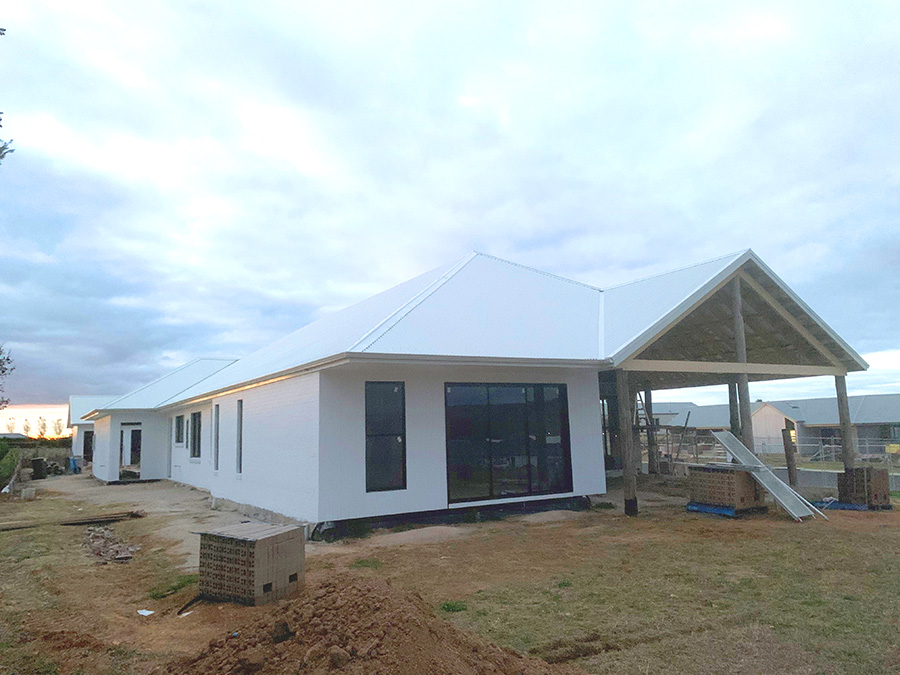 A large house with a pristine new roof