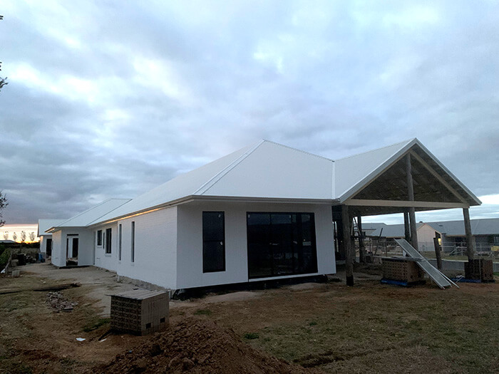 A new house with a clean, many-angled roof